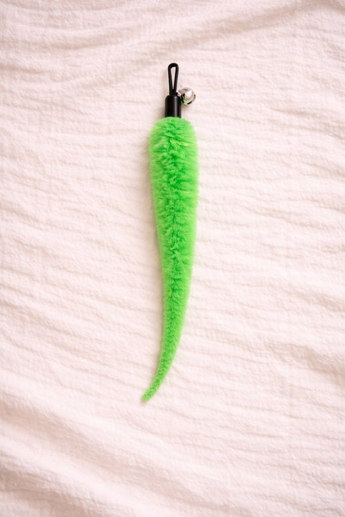 Green furry cat toy attachment with bell and clip connector
