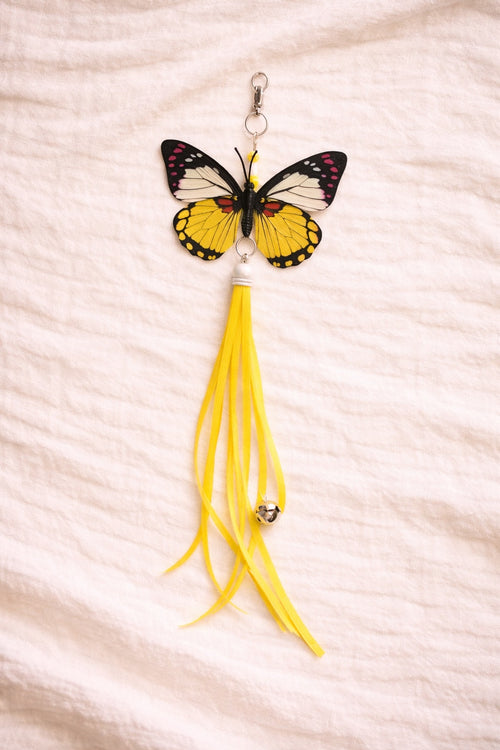 Yellow butterfly cat toy attachment with ribbon tail and clip connector